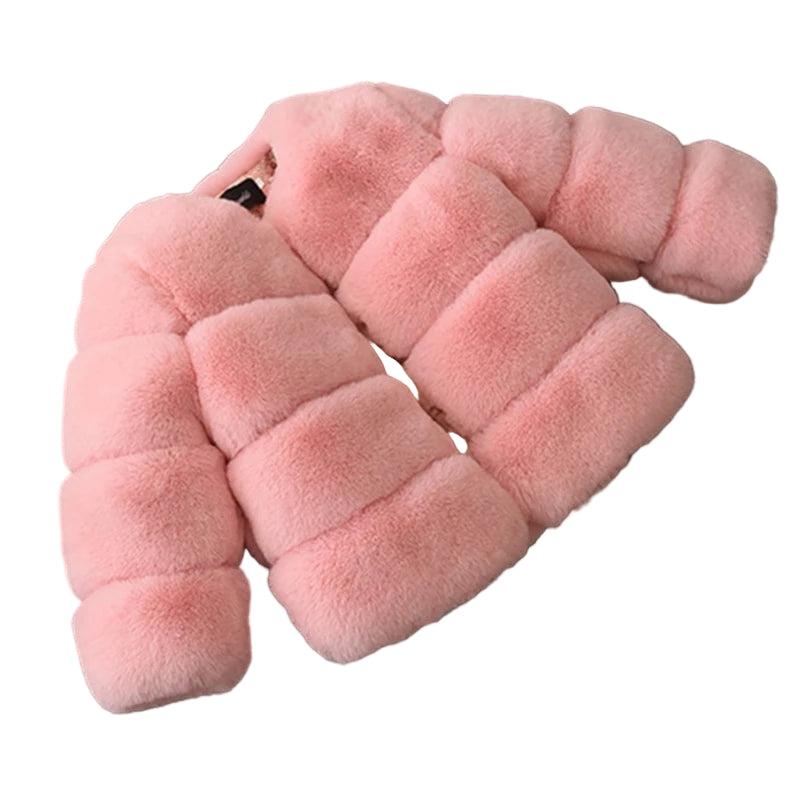 Pink plush toy shaped like a snake on a dark gray background